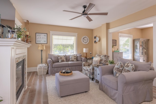 464 Kalamazoo St, South Haven, MI 49090 - living area featuring a ceiling fan, a glass covered fireplace, and light wood-style flooring
