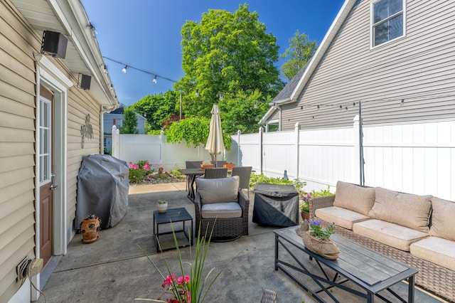 464 Kalamazoo St, South Haven, MI 49090 - fenced backyard featuring an outdoor hangout area, outdoor dining area, a patio area, and a grill