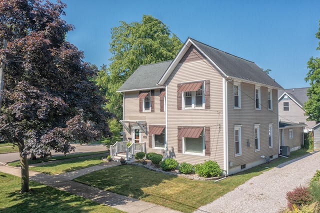 464 Kalamazoo St, South Haven, MI 49090 - view of front facade with a front lawn and a shingled roof