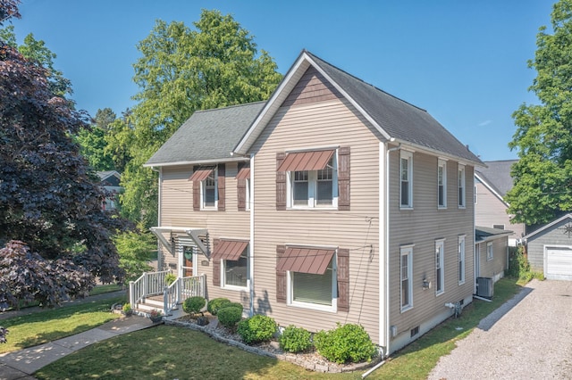 464 Kalamazoo St, South Haven, MI 49090 - townhome / multi-family property featuring a front yard, an outbuilding, and a garage