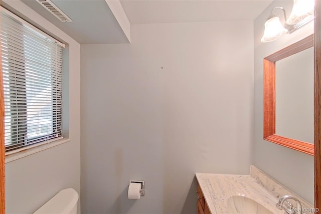 11589 Lombardy Ct, Pinckney, MI 48169 - half bathroom featuring toilet and vanity