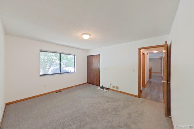 11589 Lombardy Ct, Pinckney, MI 48169 - unfurnished bedroom with light carpet and a closet