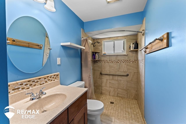 7226 Junction Rd, Frankenmuth, MI 48722 - bathroom with a tile shower, vanity, and tile patterned flooring