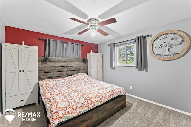 7226 Junction Rd, Frankenmuth, MI 48722 - carpeted bedroom with baseboards and a ceiling fan