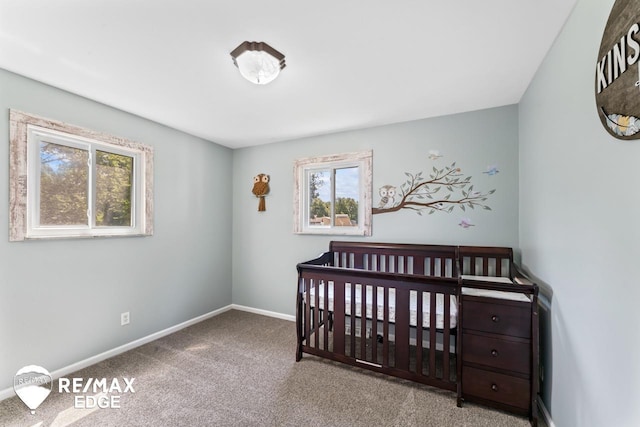 7226 Junction Rd, Frankenmuth, MI 48722 - carpeted bedroom featuring baseboards and a crib