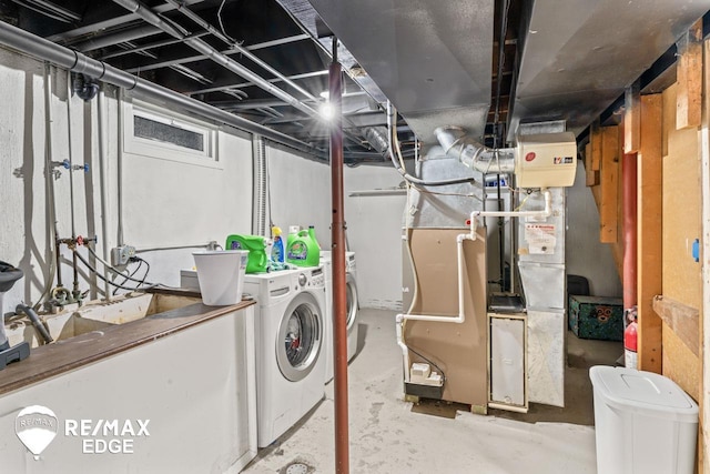 7226 Junction Rd, Frankenmuth, MI 48722 - unfinished basement featuring washing machine and clothes dryer and heating unit