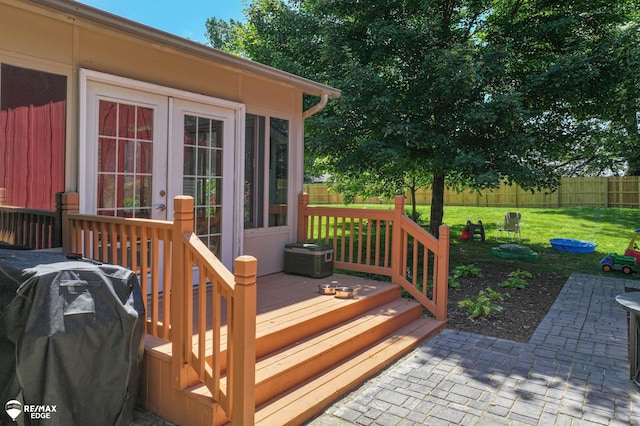 7226 Junction Rd, Frankenmuth, MI 48722 - deck featuring a grill, a fenced backyard, french doors, and a patio