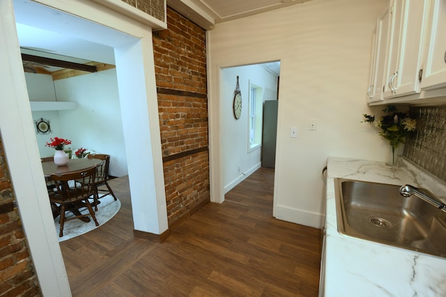 514 N Kalamazoo St, Paw Paw, MI 49079 - hall featuring brick wall and dark wood-style flooring