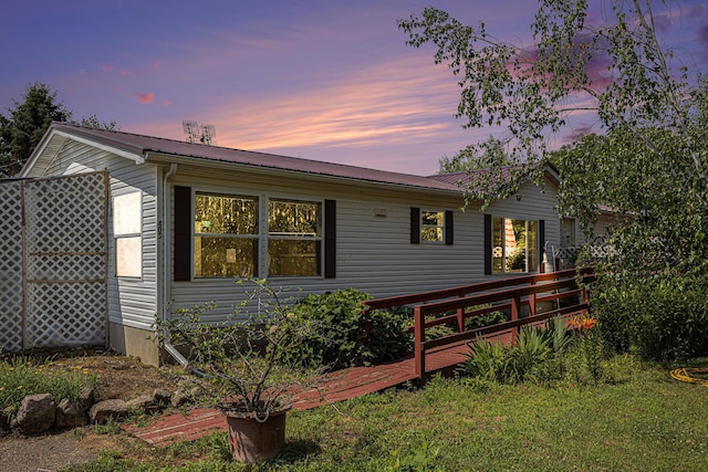 405 W Osborne Rd, Delton, MI 49046 - back of property with a metal roof and a deck