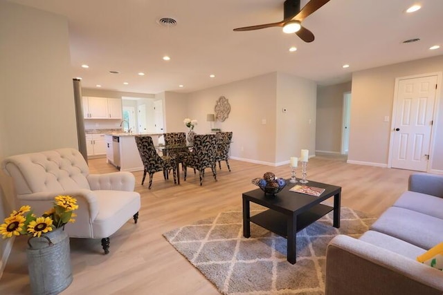 424 Doris St, Quincy, MI 49082 - living area with light wood-style flooring, ceiling fan, and recessed lighting