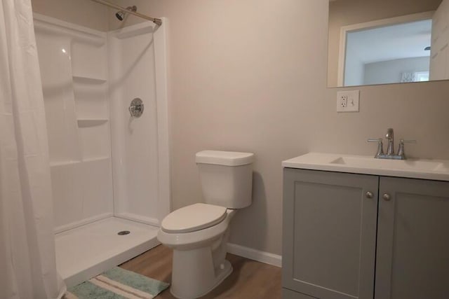 424 Doris St, Quincy, MI 49082 - bathroom featuring vanity, wood finished floors, and a shower with shower curtain