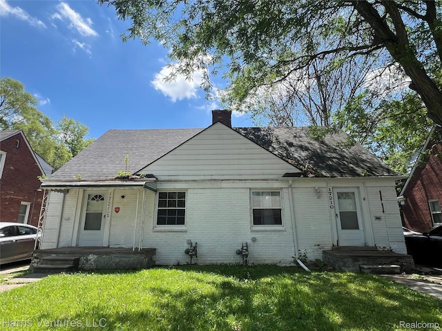 17210-12 Sioux St, Grosse Pointe, MI 48224 - bungalow-style home featuring a chimney, brick siding, and a front lawn