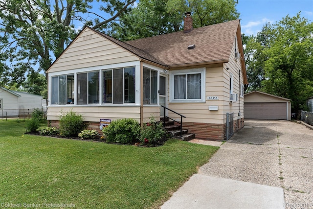 22355 Curie Ave, Warren, MI 48091 - bungalow-style home featuring roof with shingles, a sunroom, a garage, an outbuilding, and a chimney