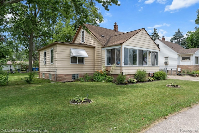 22355 Curie Ave, Warren, MI 48091 - view of front of property featuring roof with shingles, a sunroom, and a fire pit