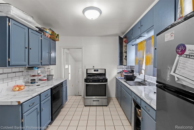 22355 Curie Ave, Warren, MI 48091 - kitchen with appliances with stainless steel finishes, blue cabinetry, backsplash, and light tile patterned floors