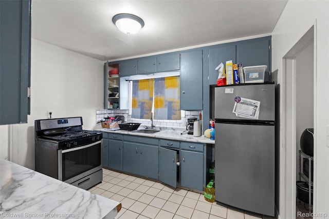 22355 Curie Ave, Warren, MI 48091 - kitchen featuring stainless steel appliances, blue cabinetry, backsplash, light tile patterned floors, and light stone countertops