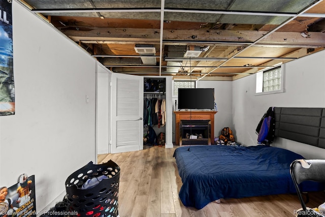22355 Curie Ave, Warren, MI 48091 - bedroom featuring wood finished floors and a closet