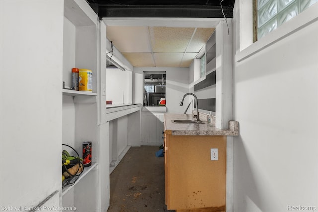 22355 Curie Ave, Warren, MI 48091 - kitchen featuring open shelves, concrete flooring, and a paneled ceiling