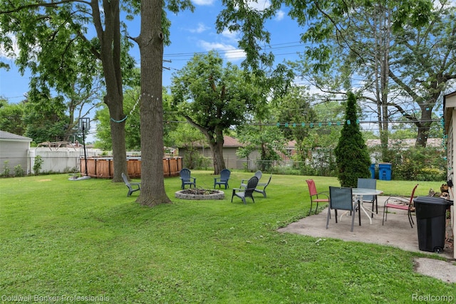 22355 Curie Ave, Warren, MI 48091 - fenced backyard with an outdoor fire pit and a patio area