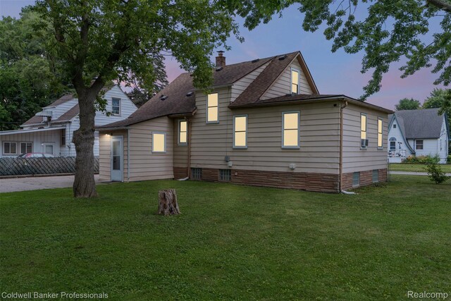 22355 Curie Ave, Warren, MI 48091 - back of property featuring roof with shingles, a chimney, and crawl space