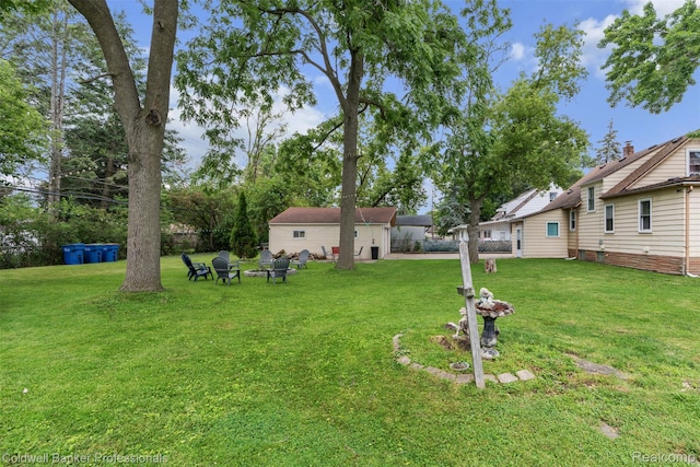 22355 Curie Ave, Warren, MI 48091 - view of grassy yard with a fire pit