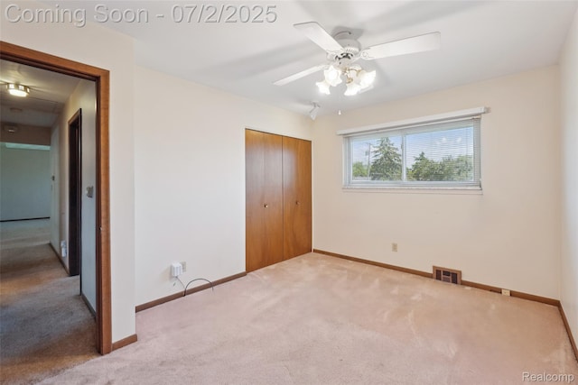 54829 Starlite Dr, Shelby Twp, MI 48316 - unfurnished bedroom featuring carpet, a closet, and ceiling fan