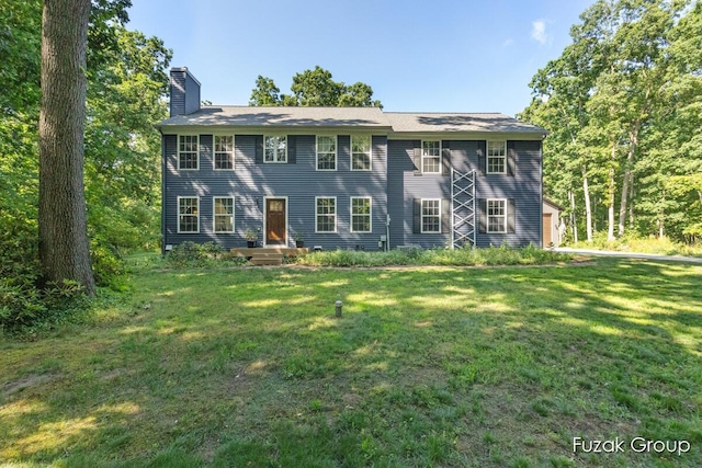 3268 Michele Ln, Hamilton, MI 49419 - view of front of house with a chimney and a front lawn
