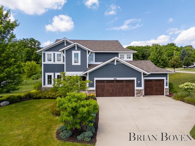 9633 Waterstone Dr, Byron Center, MI 49315 - view of front of house featuring an attached garage, a front yard, concrete driveway, and stone siding