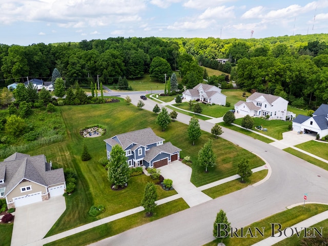 9633 Waterstone Dr, Byron Center, MI 49315 - aerial view of residential area with a heavily wooded area