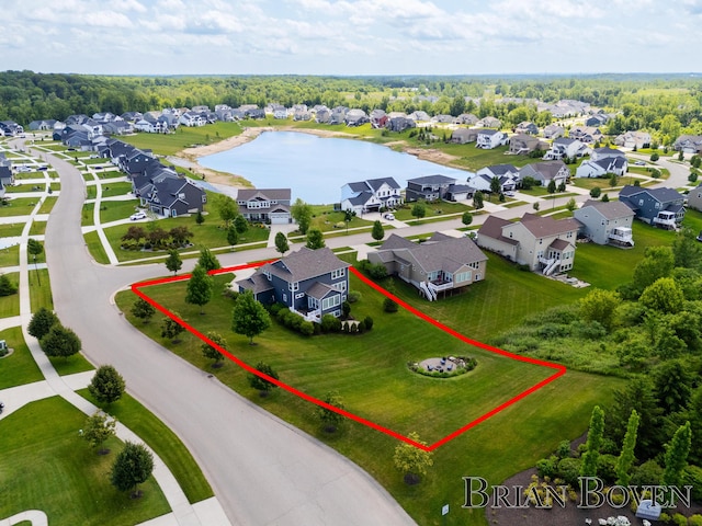 9633 Waterstone Dr, Byron Center, MI 49315 - aerial view of residential area with property boundaries highlighted and a nearby body of water