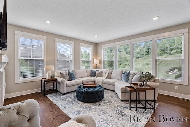 9633 Waterstone Dr, Byron Center, MI 49315 - living room with dark wood finished floors and recessed lighting