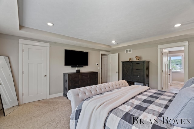 9633 Waterstone Dr, Byron Center, MI 49315 - bedroom featuring a tray ceiling, light carpet, and recessed lighting