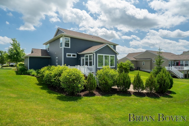 9633 Waterstone Dr, Byron Center, MI 49315 - rear view of property with a lawn