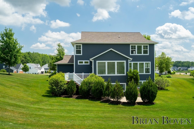 9633 Waterstone Dr, Byron Center, MI 49315 - back of house featuring a lawn and a wooden deck