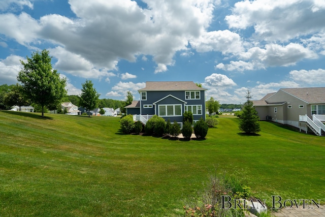 9633 Waterstone Dr, Byron Center, MI 49315 - rear view of property featuring a yard and a residential view