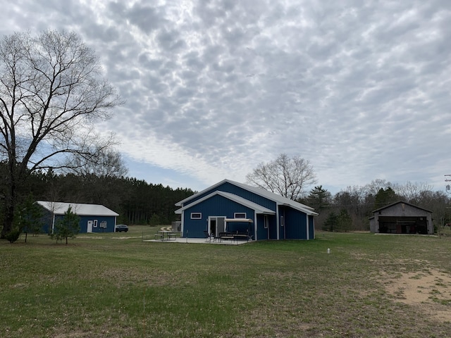 4969 N Highbridge Rd, Brethren, MI 49619 - view of grassy yard with an outdoor structure and a pole building