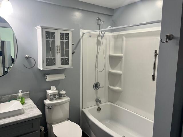 4969 N Highbridge Rd, Brethren, MI 49619 - full bathroom featuring vanity and bathtub / shower combination