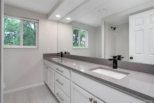 684 Abbey Ct, Rochester Hills, MI 48307 - full bathroom with double vanity, recessed lighting, and a shower