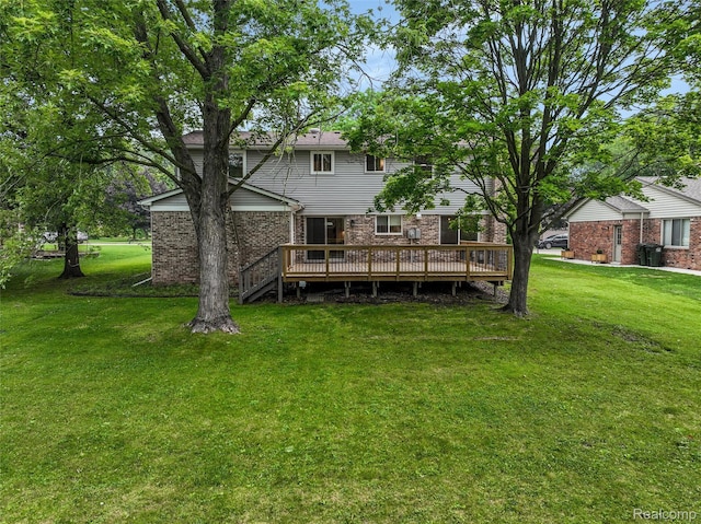 684 Abbey Ct, Rochester Hills, MI 48307 - back of property featuring a deck, a lawn, and brick siding