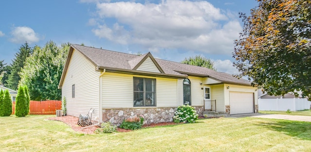 215 W State St, Coldwater, MI 49036 - ranch-style home with a garage, stone siding, concrete driveway, and roof with shingles