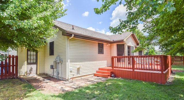 215 W State St, Coldwater, MI 49036 - rear view of house with a deck and a shingled roof