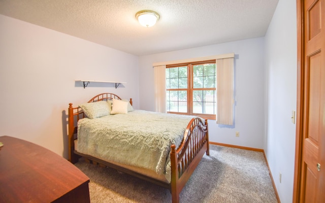215 W State St, Coldwater, MI 49036 - carpeted bedroom featuring a textured ceiling and baseboards