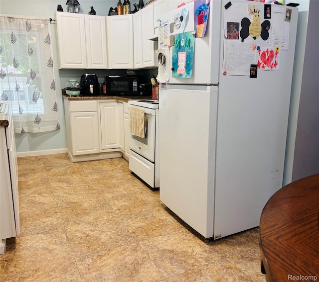 104 Park Ave, Yale, MI 48097 - kitchen with white appliances, white cabinets, and dark countertops