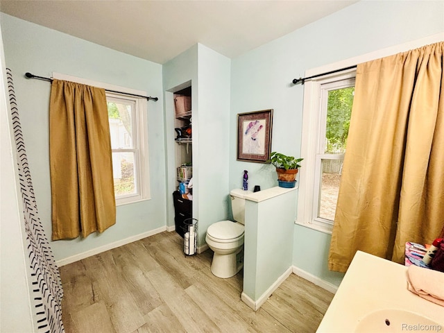 104 Park Ave, Yale, MI 48097 - bathroom featuring wood finished floors, healthy amount of natural light, and vanity