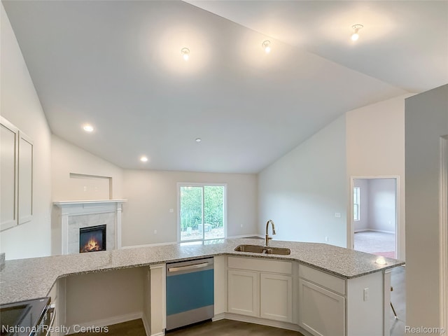 253 Devonshire Dr Unit 2, Lapeer, MI 48446 - kitchen featuring dishwashing machine, vaulted ceiling, light stone countertops, open floor plan, and a tile fireplace