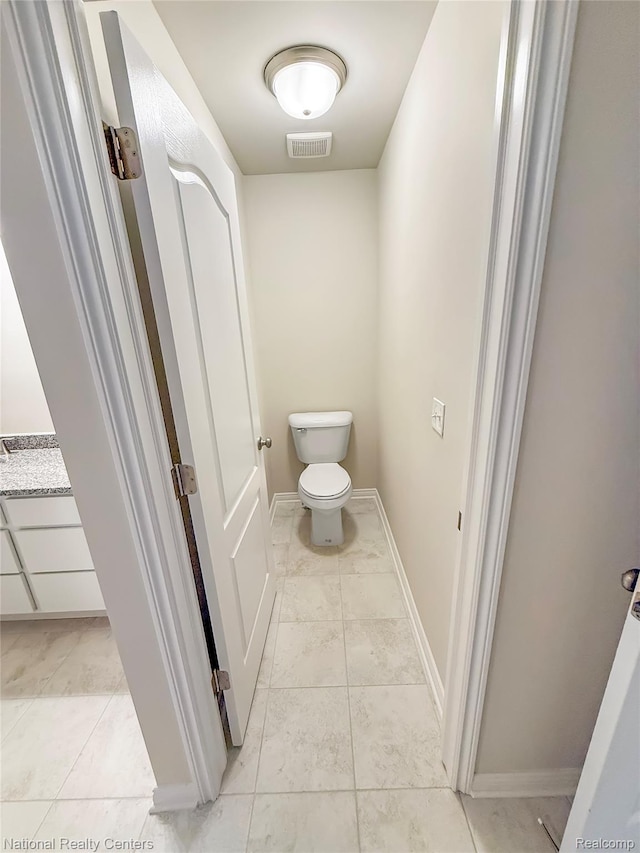 253 Devonshire Dr Unit 2, Lapeer, MI 48446 - bathroom with toilet and baseboards