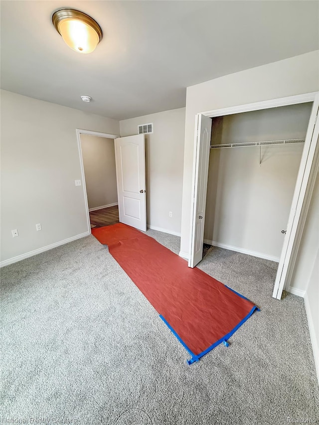 253 Devonshire Dr Unit 2, Lapeer, MI 48446 - unfurnished bedroom with carpet flooring and a closet