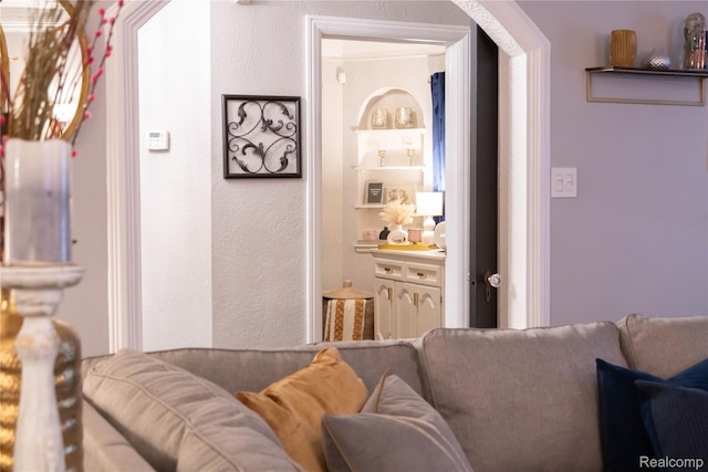 17417 San Juan Dr, Detroit, MI 48221 - living room featuring a textured wall and arched walkways