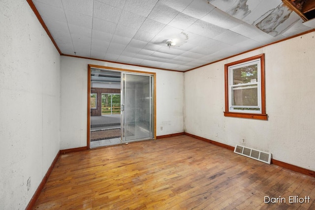 7985 Island View Dr, Newaygo, MI 49337 - spare room with wood-type flooring and ornamental molding