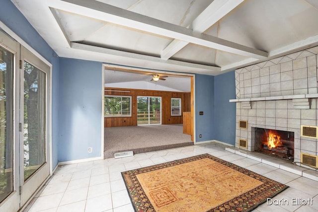 7985 Island View Dr, Newaygo, MI 49337 - unfurnished living room with tile patterned floors, a tile fireplace, and ceiling fan